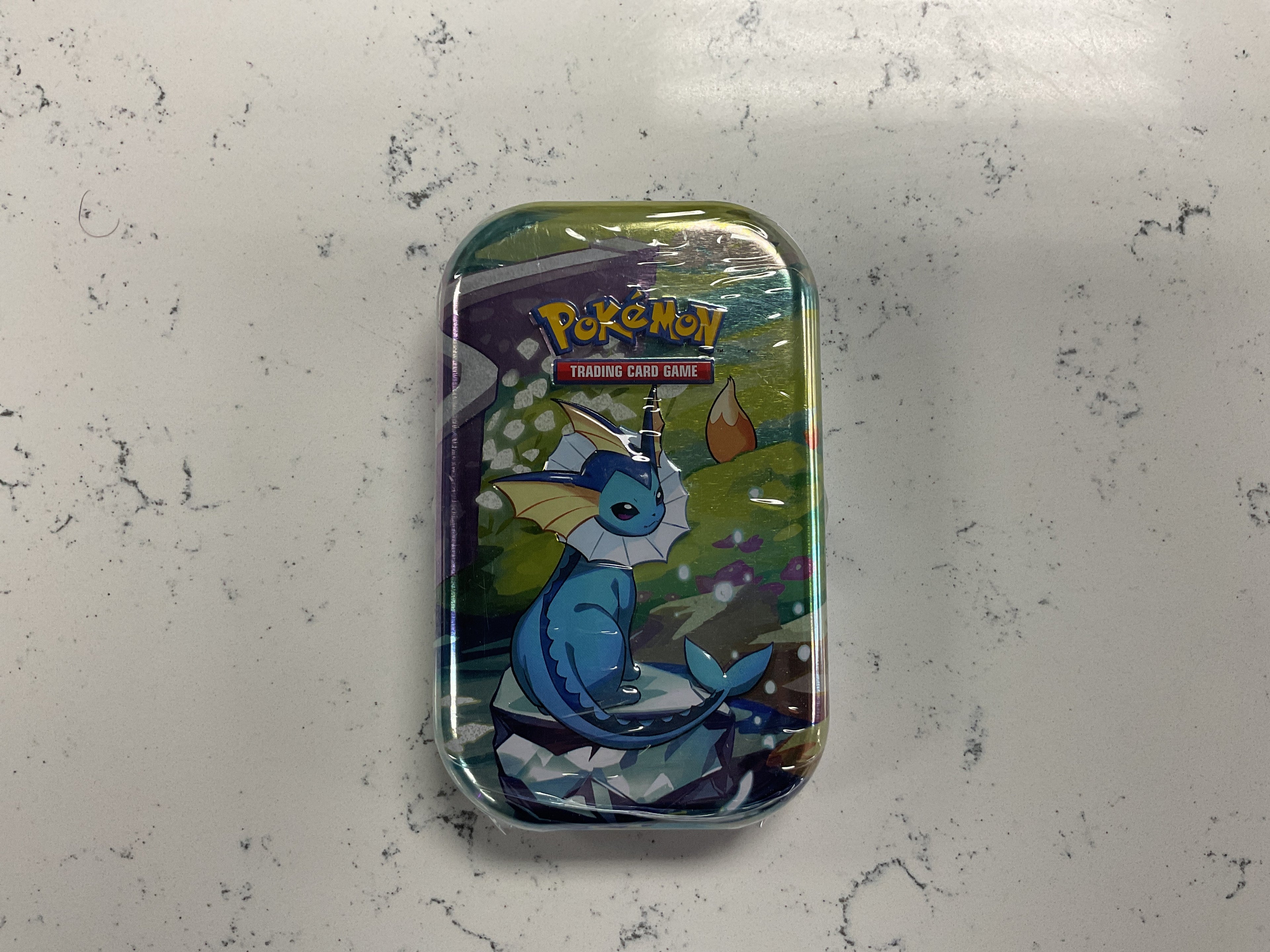 Prismatic evolutions mini tin